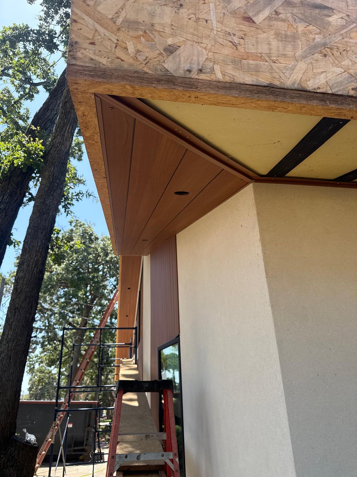 Residential home exterior during a siding remodel