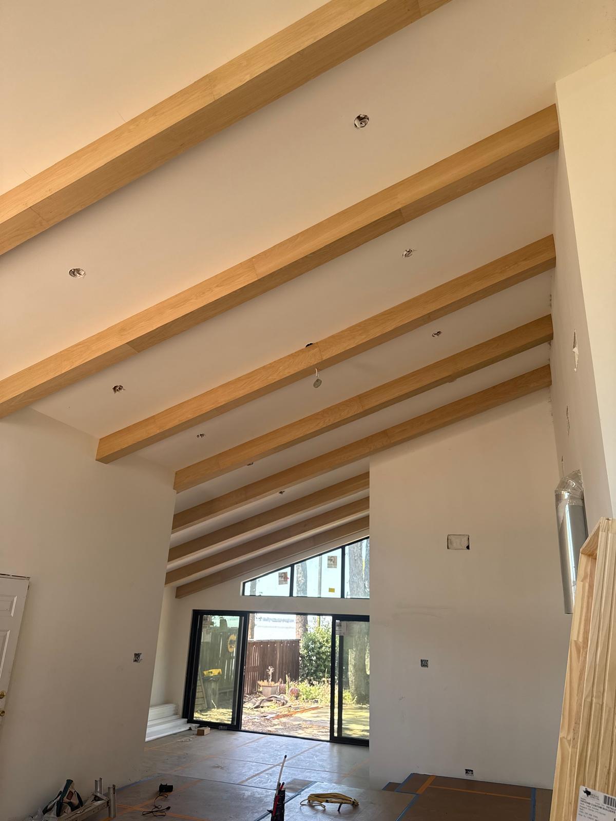 Detailed faux cedar beam finish in a custom interior
