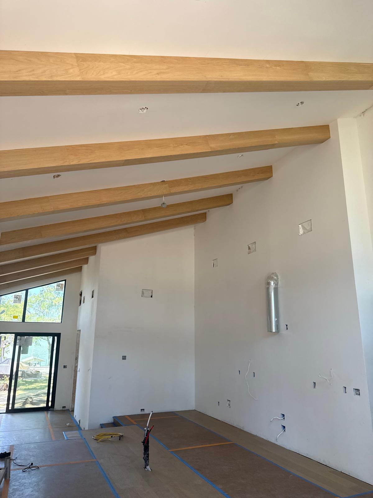 Decorative faux wood beams installed in a custom home