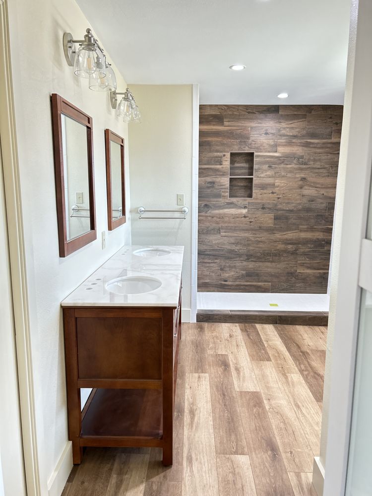 Gray kitchen cabinetry with marble-look flooring