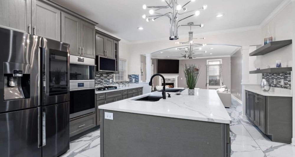 Remodeled kitchen with a large island and pendant lighting